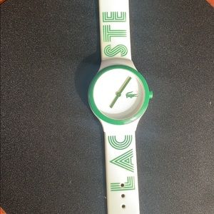 Pearl white Lacoste watch.